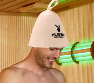 Happy couple enjoying in sauna treatment at health spa.