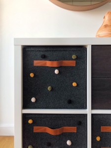 Colorful ball embellishments and square felt storage add customized fun to your space.